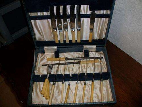 old cateen box with bone handle butter knifes and some forks etc